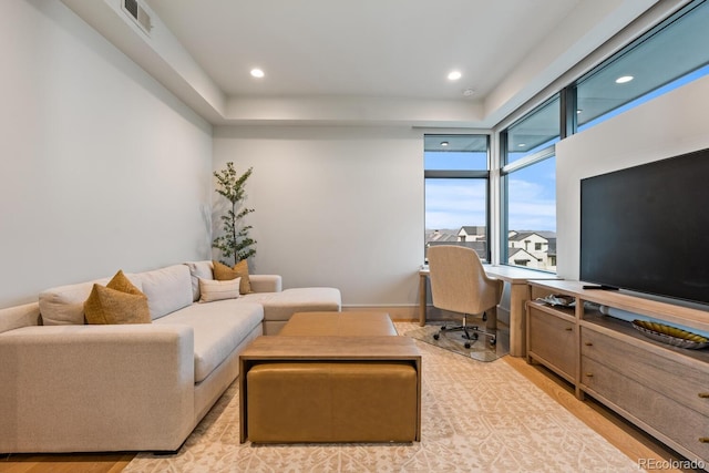 office featuring recessed lighting, baseboards, visible vents, and light wood-style flooring