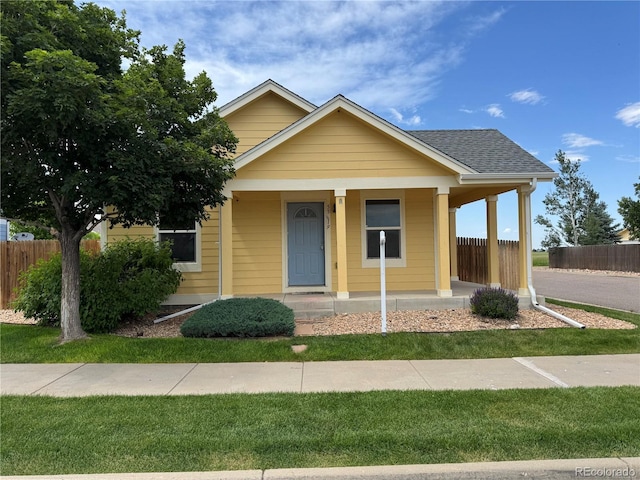 55619 E 31st Ave, Strasburg, CO 80136 - view of front facade with a porch and a shingled roof