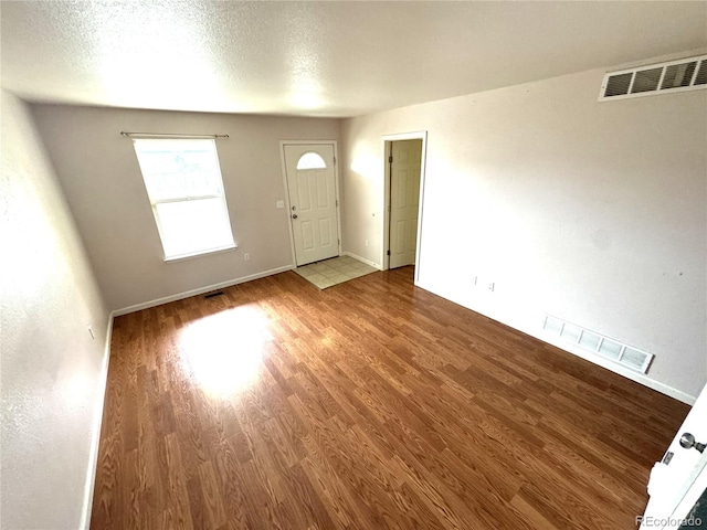 55619 E 31st Ave, Strasburg, CO 80136 - entryway featuring wood finished floors and baseboards