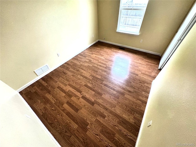 55619 E 31st Ave, Strasburg, CO 80136 - unfurnished room with wood finished floors and baseboards