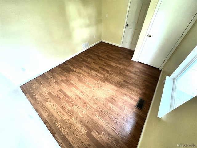 55619 E 31st Ave, Strasburg, CO 80136 - spare room featuring wood finished floors and baseboards