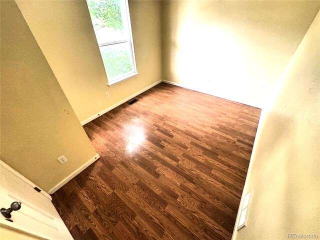 55619 E 31st Ave, Strasburg, CO 80136 - spare room with wood finished floors and baseboards