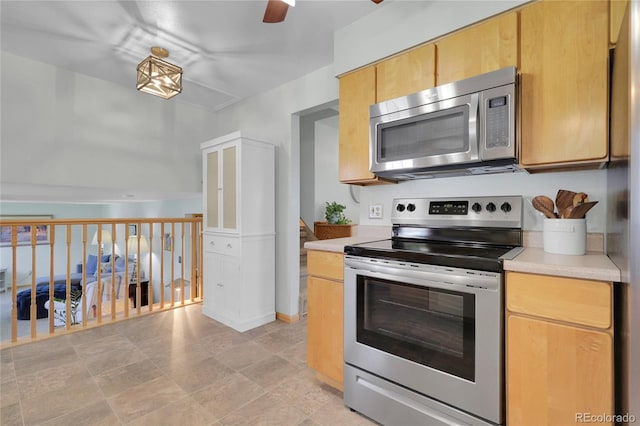 kitchen featuring light countertops, a ceiling fan, and stainless steel appliances