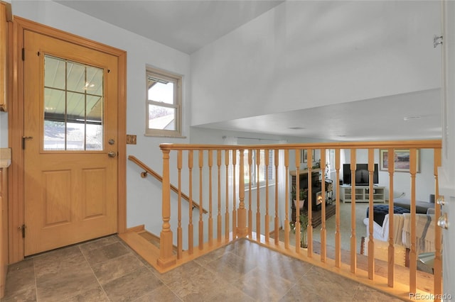 foyer entrance featuring baseboards