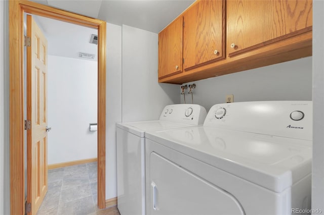 laundry room featuring cabinet space, visible vents, baseboards, and washing machine and dryer