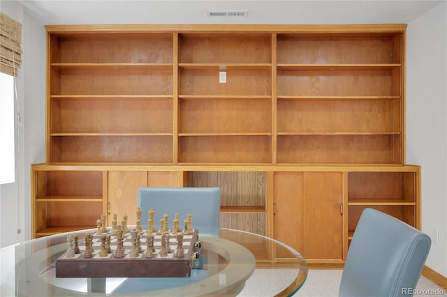 unfurnished dining area featuring visible vents