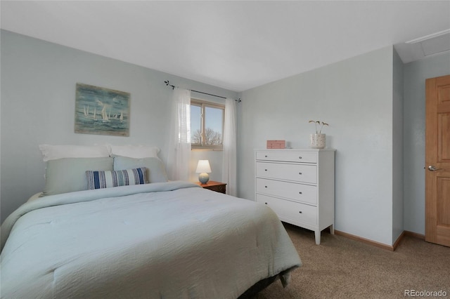 bedroom with baseboards and carpet