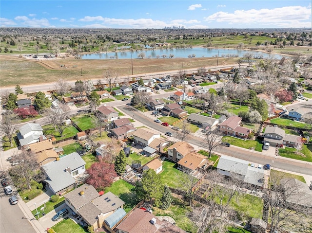 birds eye view of property featuring a residential view and a water view