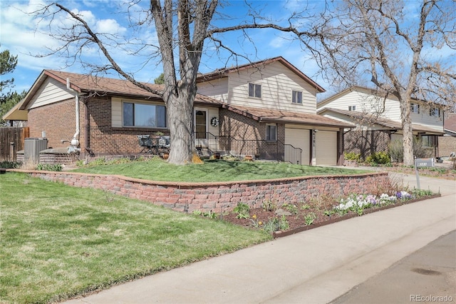 4381 S Estes St, Littleton, CO 80123 - view of front of home with brick siding, an attached garage, cooling unit, and concrete driveway
