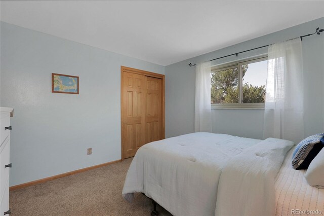 4381 S Estes St, Littleton, CO 80123 - carpeted bedroom featuring baseboards and a closet
