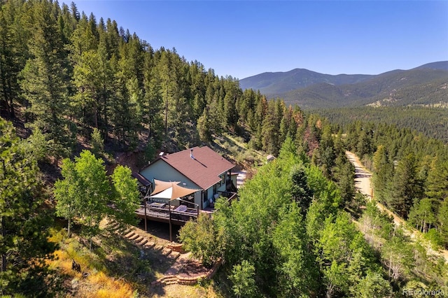 288 Spring Vly, Bailey, CO 80421 - aerial view of property and surrounding area featuring a forest and a mountainous background