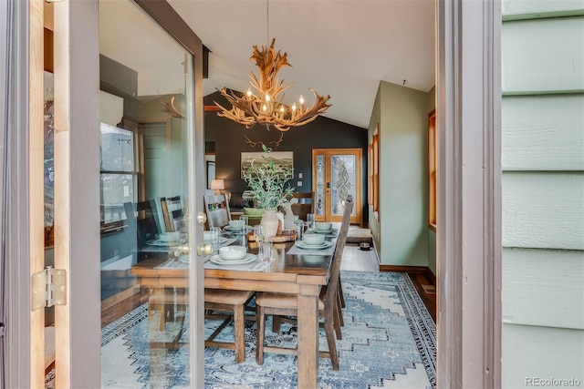 288 Spring Vly, Bailey, CO 80421 - dining area with a chandelier, lofted ceiling, and wood finished floors