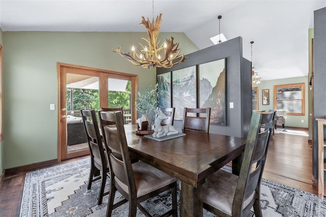 288 Spring Vly, Bailey, CO 80421 - dining space featuring a chandelier, lofted ceiling, and wood-type flooring