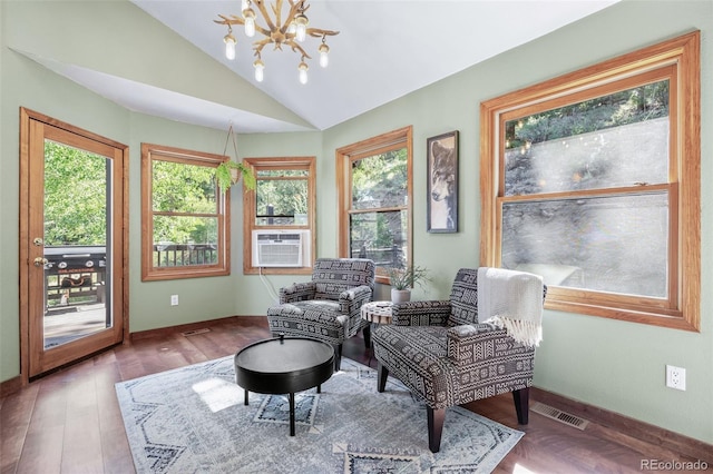288 Spring Vly, Bailey, CO 80421 - sitting room featuring a chandelier, cooling unit, vaulted ceiling, and wood finished floors