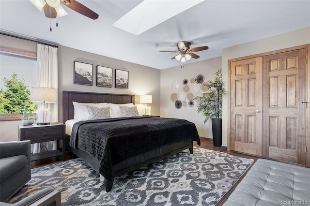288 Spring Vly, Bailey, CO 80421 - bedroom with a ceiling fan, a skylight, and wood finished floors