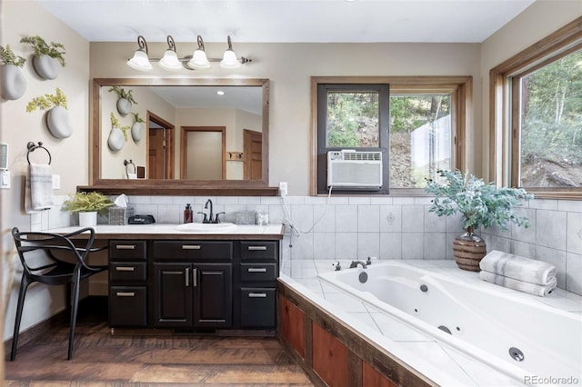 288 Spring Vly, Bailey, CO 80421 - full bath featuring vanity, a tub with jets, decorative backsplash, and cooling unit