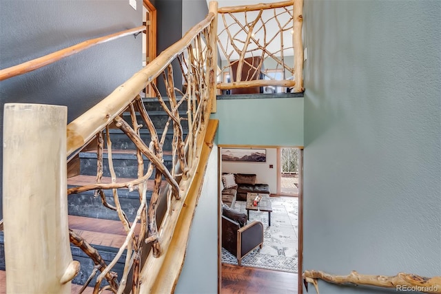 288 Spring Vly, Bailey, CO 80421 - stairs with wood finished floors and a towering ceiling