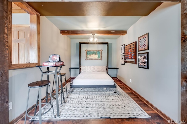 288 Spring Vly, Bailey, CO 80421 - bedroom featuring wood finished floors and beamed ceiling