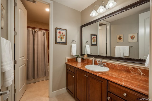 full bathroom featuring tile patterned flooring, vanity, a shower with shower curtain, and baseboards