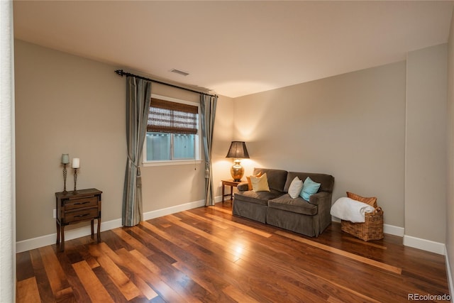 sitting room with wood finished floors and baseboards