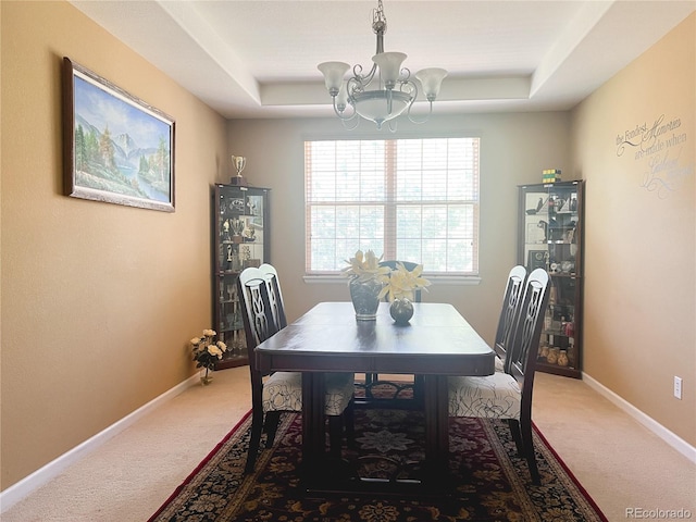 6035 S Paris St, Englewood, CO 80111 - dining space with light carpet, a chandelier, and healthy amount of natural light