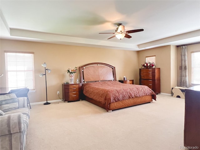 6035 S Paris St, Englewood, CO 80111 - bedroom with a raised ceiling, light colored carpet, and multiple windows