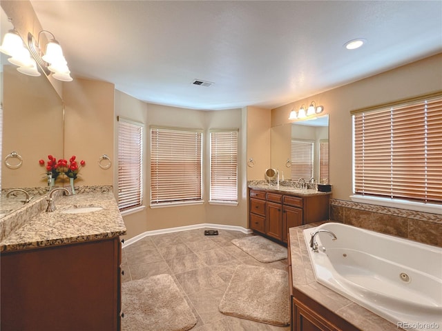 6035 S Paris St, Englewood, CO 80111 - bathroom featuring two vanities, a tub with jets, tile patterned flooring, a chandelier, and recessed lighting