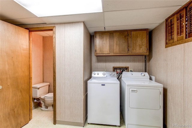 laundry area with cabinets and separate washer and dryer