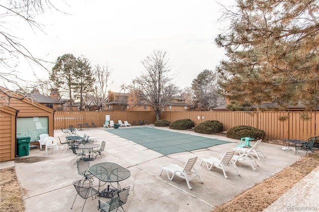 view of swimming pool with a patio area