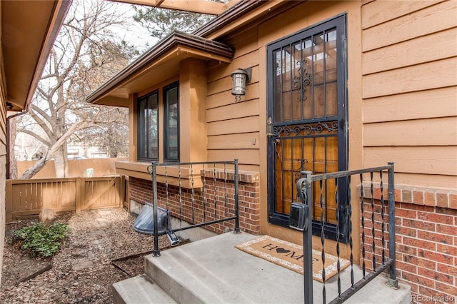 property entrance featuring fence