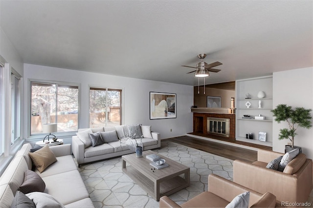 53 S Eagle Cir, Aurora, CO 80012 - living room with wood finished floors, ceiling fan, and built in features