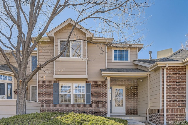 112 W Sterne Pkwy, Littleton, CO 80120 - view of front facade featuring brick siding