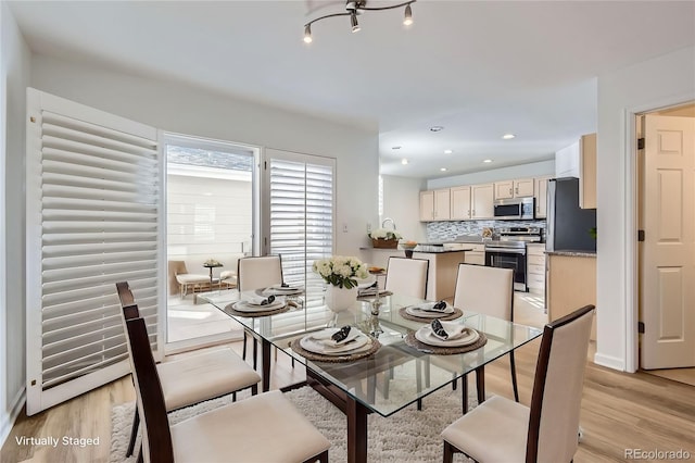 112 W Sterne Pkwy, Littleton, CO 80120 - dining area featuring light wood-style flooring