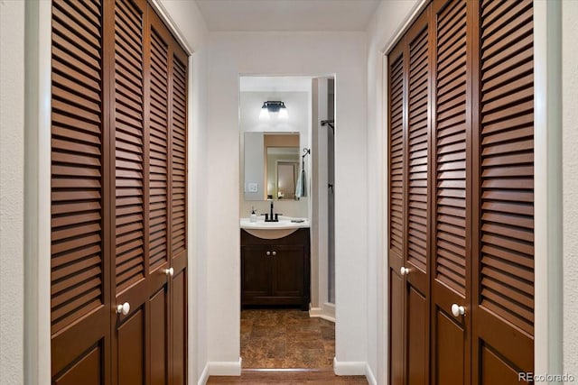 2615 Centre Ln, Colorado Springs, CO 80909 - hall featuring a sink and baseboards