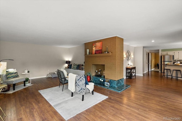 2615 Centre Ln, Colorado Springs, CO 80909 - living area with wood finished floors and a fireplace