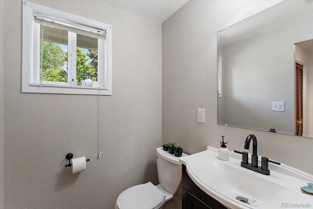 2615 Centre Ln, Colorado Springs, CO 80909 - bathroom featuring vanity and a textured wall