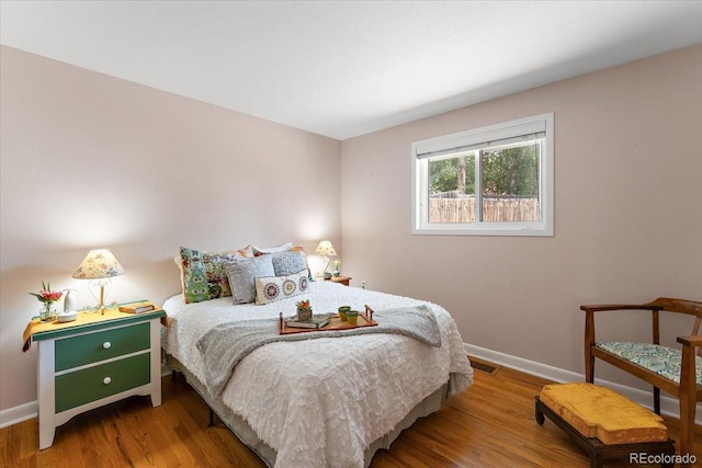 2615 Centre Ln, Colorado Springs, CO 80909 - bedroom with baseboards and wood finished floors
