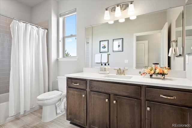 full bathroom with toilet, shower / tub combo, and vanity