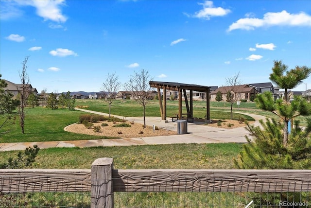 surrounding community with a yard and a gazebo
