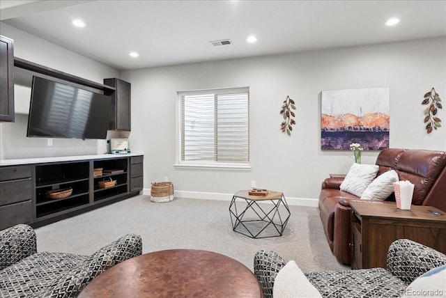 carpeted living area featuring baseboards, recessed lighting, and visible vents