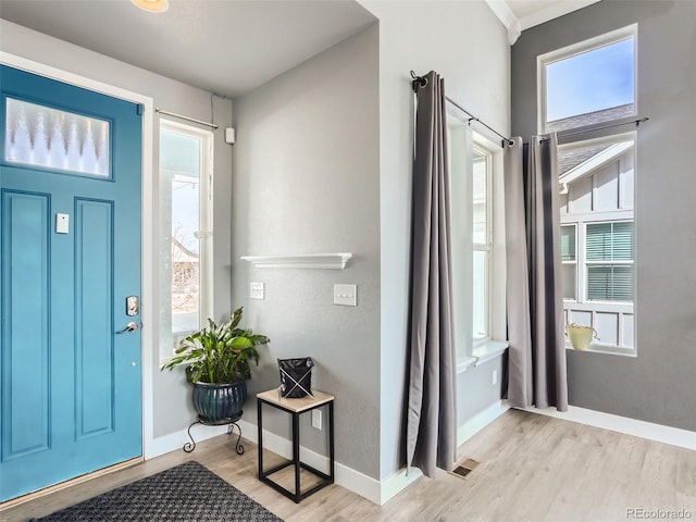 4628 Mt Shavano St, Brighton, CO 80601 - foyer entrance with wood finished floors and plenty of natural light