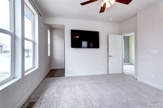 4628 Mt Shavano St, Brighton, CO 80601 - carpeted empty room with a ceiling fan and a smoke detector