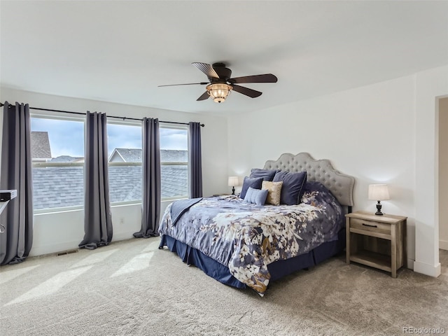 4628 Mt Shavano St, Brighton, CO 80601 - carpeted bedroom with multiple windows and a ceiling fan