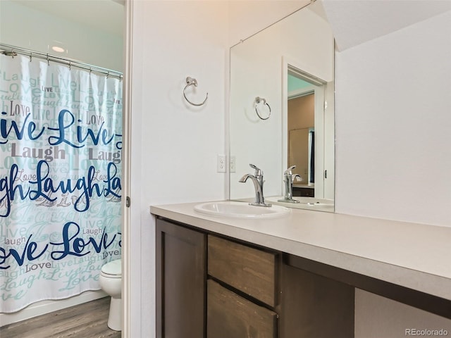 4628 Mt Shavano St, Brighton, CO 80601 - bathroom featuring vanity and wood finished floors