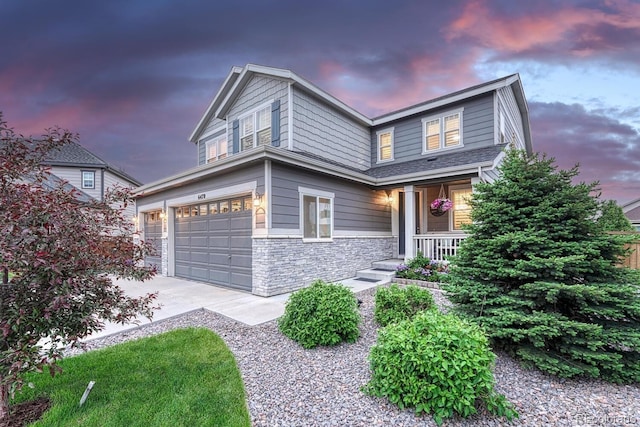 6470 Amur Ct, Castle Rock, CO 80108 - view of front of home featuring stone siding, a garage, a porch, and concrete driveway