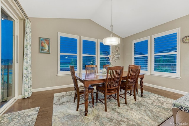 6470 Amur Ct, Castle Rock, CO 80108 - dining space with lofted ceiling, wood finished floors, and baseboards