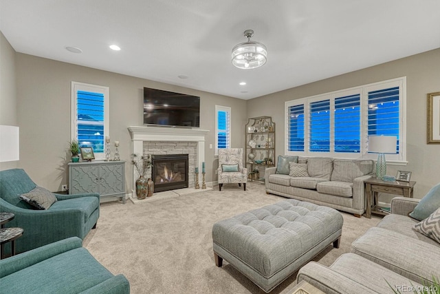 6470 Amur Ct, Castle Rock, CO 80108 - carpeted living area featuring a stone fireplace and recessed lighting