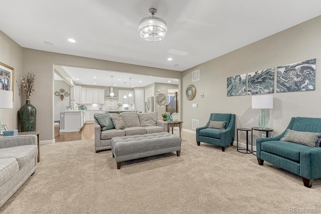 6470 Amur Ct, Castle Rock, CO 80108 - living area featuring light colored carpet, baseboards, and recessed lighting