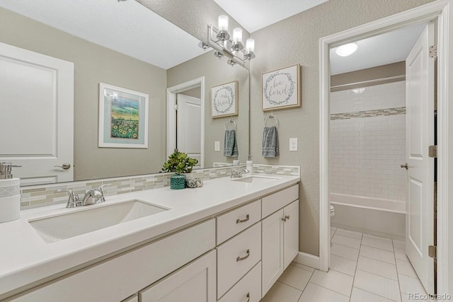 6470 Amur Ct, Castle Rock, CO 80108 - full bath featuring double vanity, toilet, tile patterned flooring, washtub / shower combination, and a textured wall