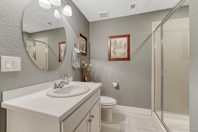 6470 Amur Ct, Castle Rock, CO 80108 - full bathroom featuring vanity, toilet, a shower stall, marble look tiles, and a textured wall